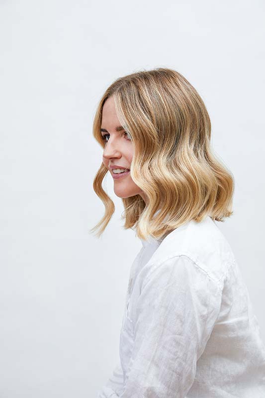 Blonde balayage with baby-lights and a root smudge
